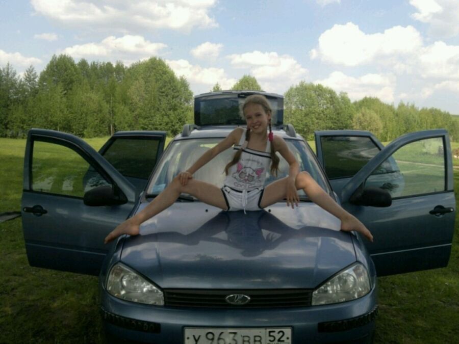 young teen posing outdoors