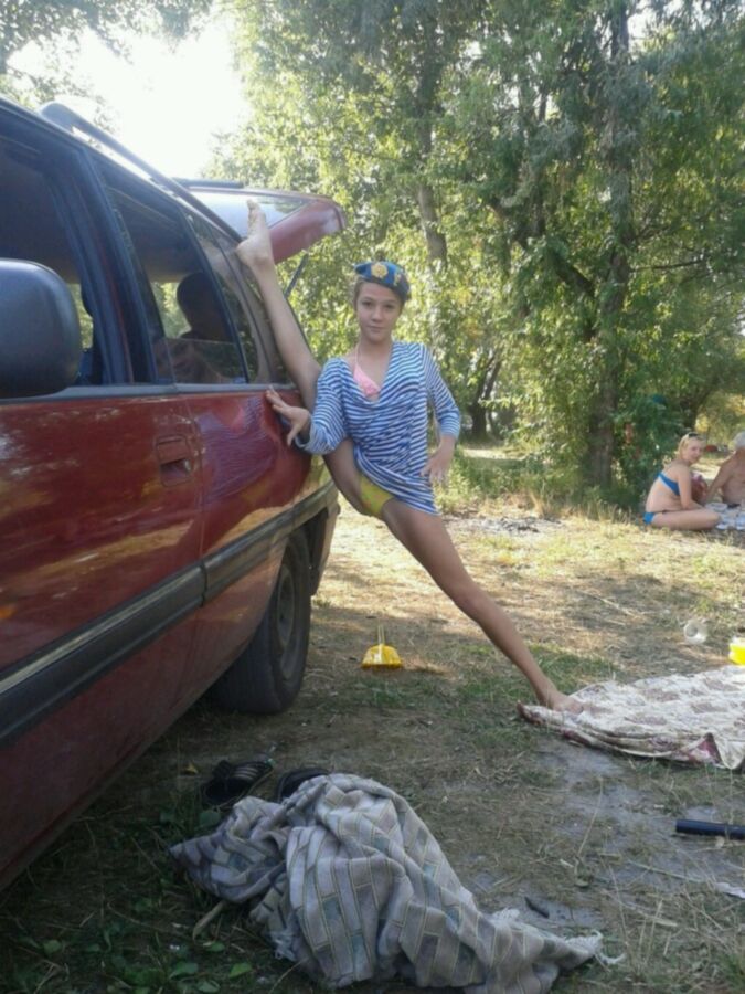 young teen posing outdoors