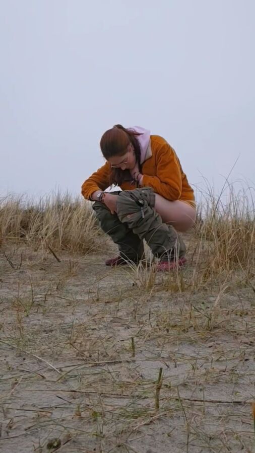 Ugly ginger pees at the beach