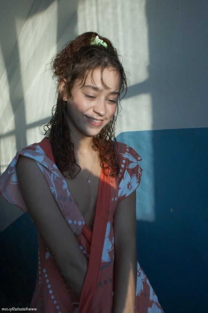 Natasha open clothes