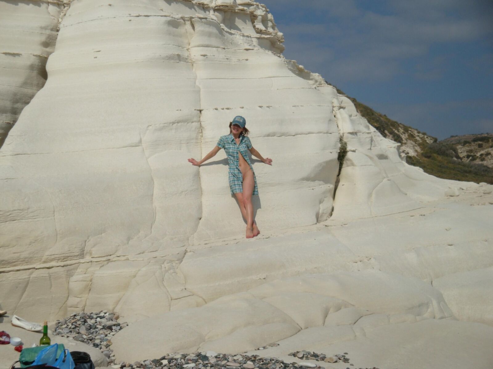 Beautiful girls posing on a white rock beach