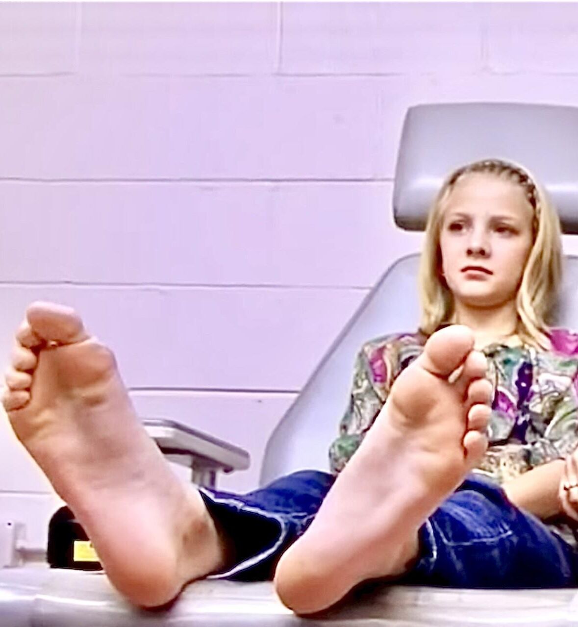 Anxious blond goes to the Dr., and gets her LONG soles exposed