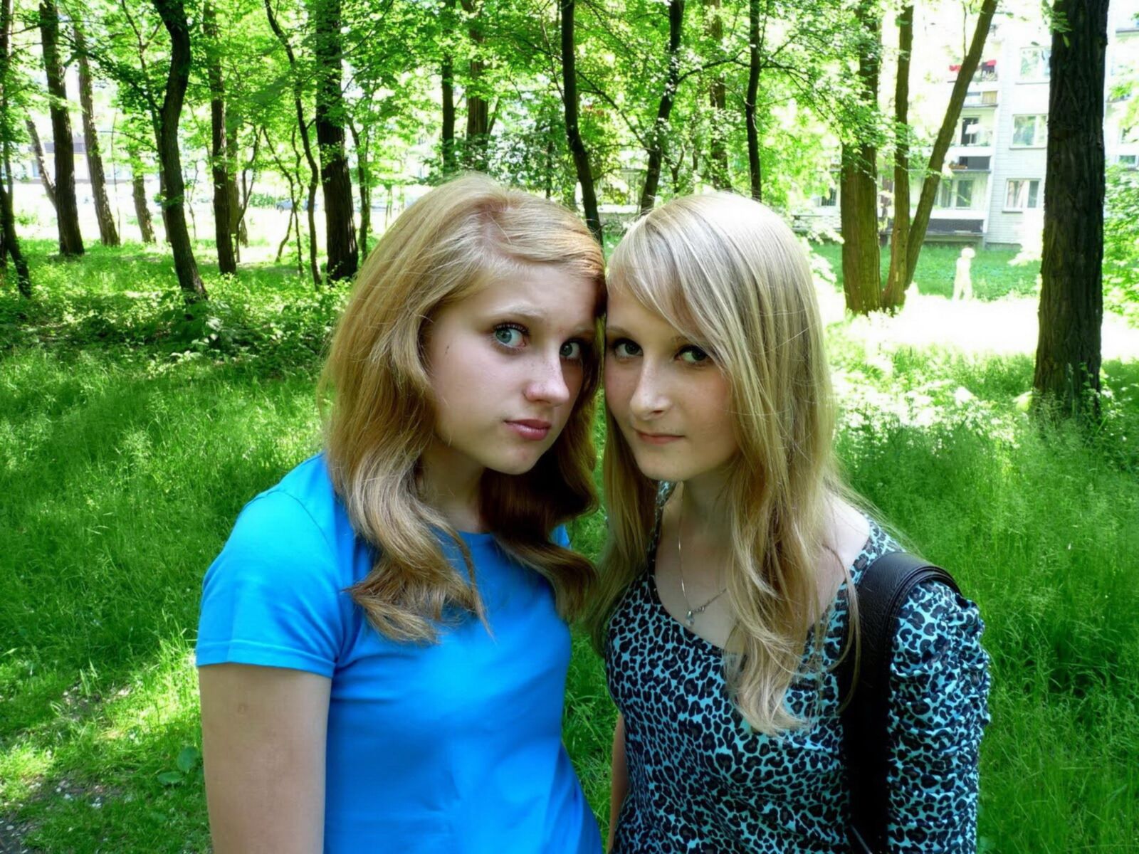 Two teen girls photographing each other