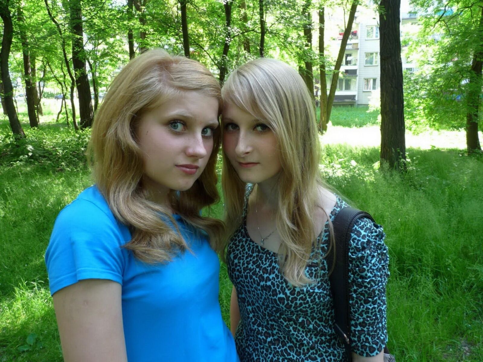 Two teen girls photographing each other