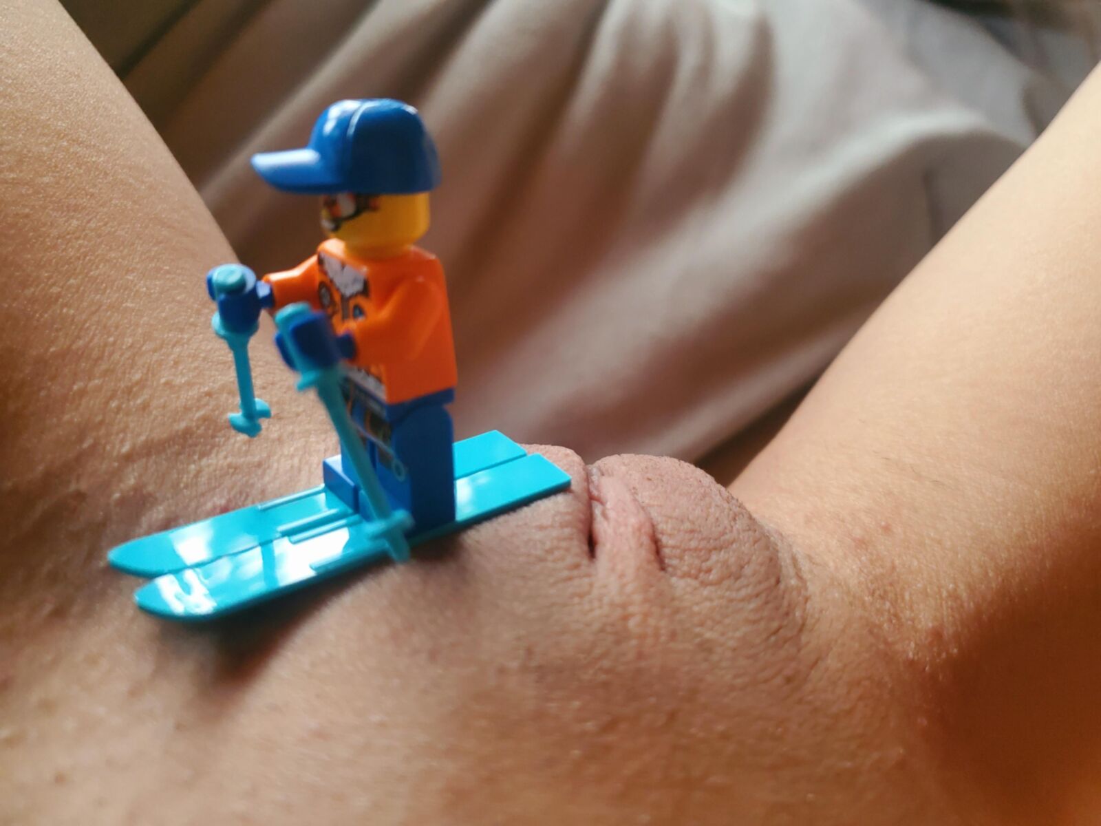Teen plays with Lego