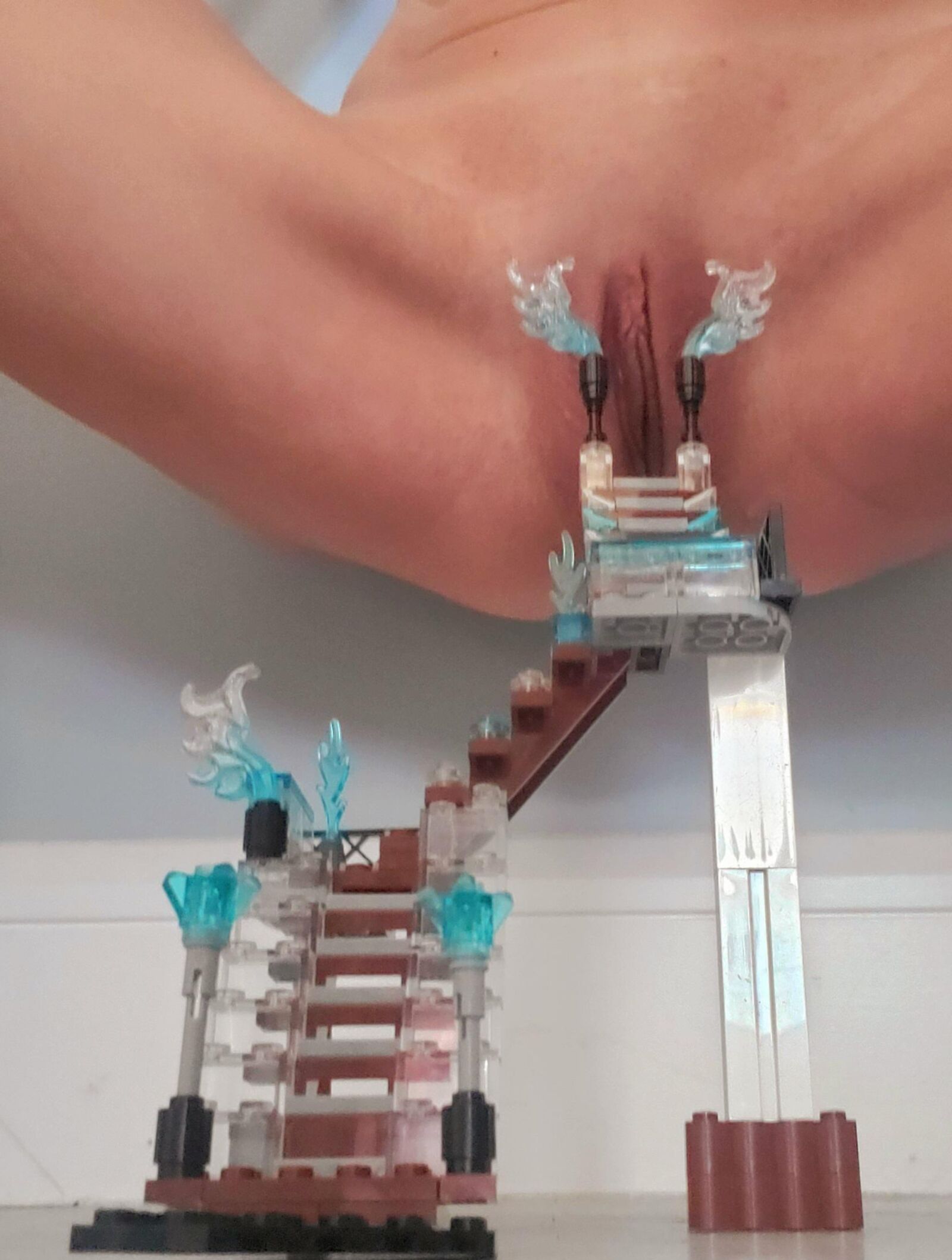 Teen plays with Lego