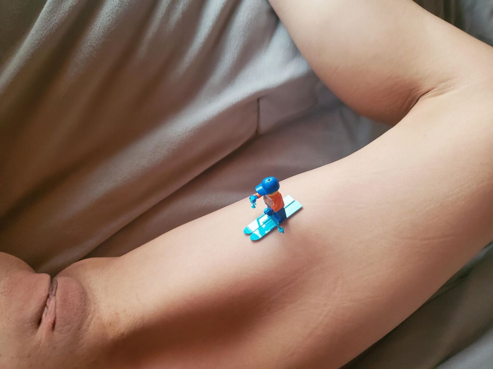 Teen plays with Lego