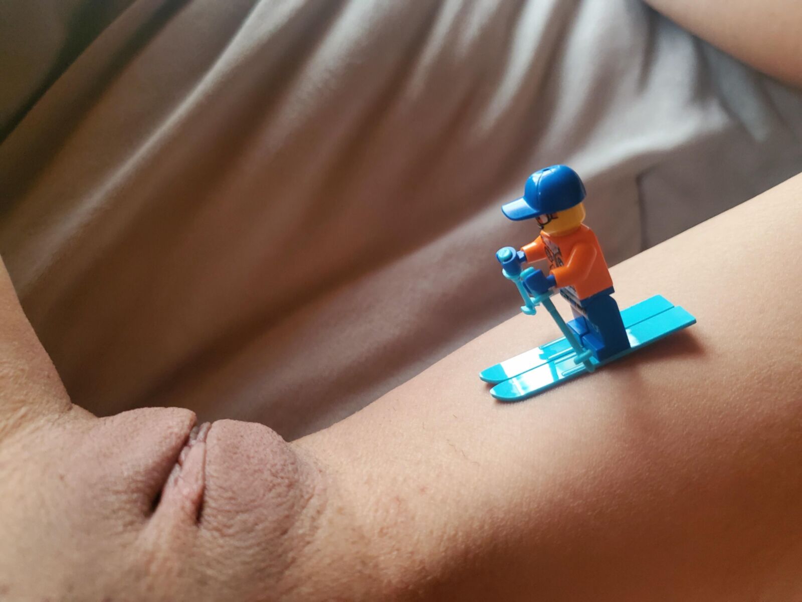 Teen plays with Lego