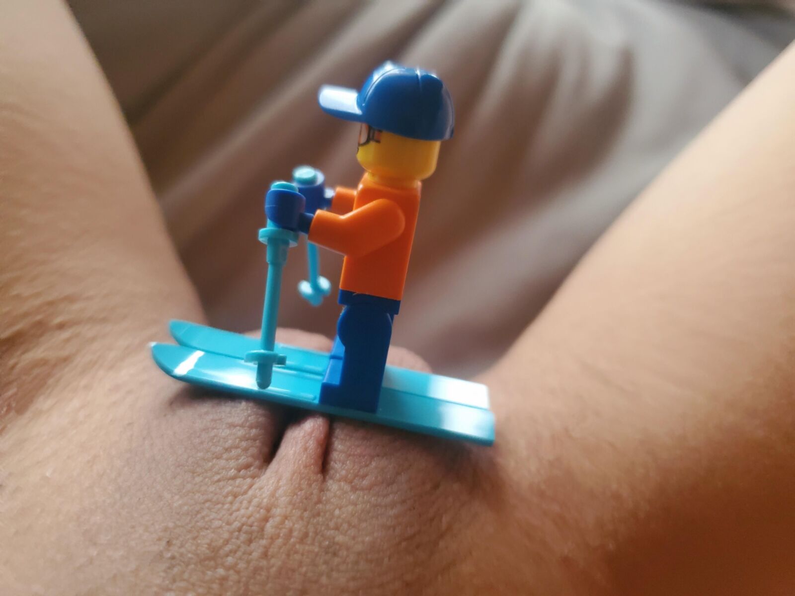 Teen plays with Lego