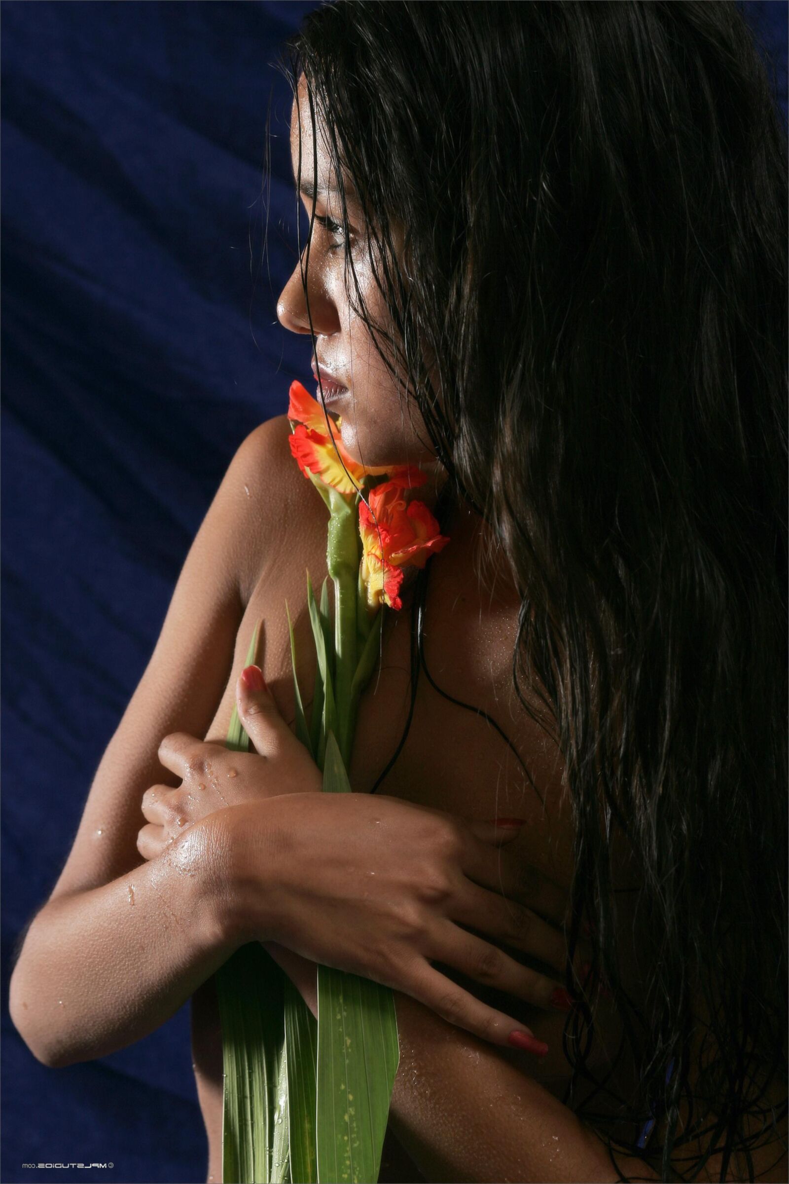 Kamilla with a flower fully nude teen on the bed