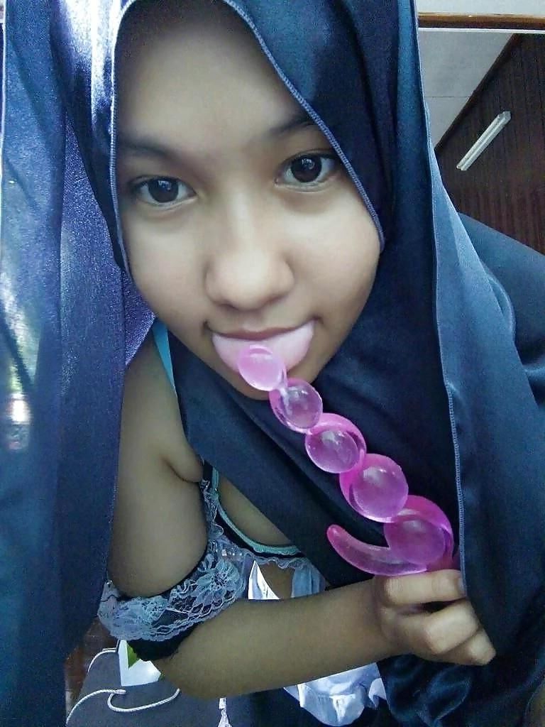Indonesian Hijab teen being naughty