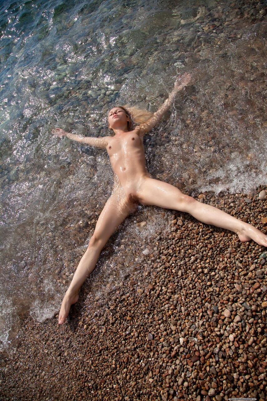 Blonde cute teen nude at the beach