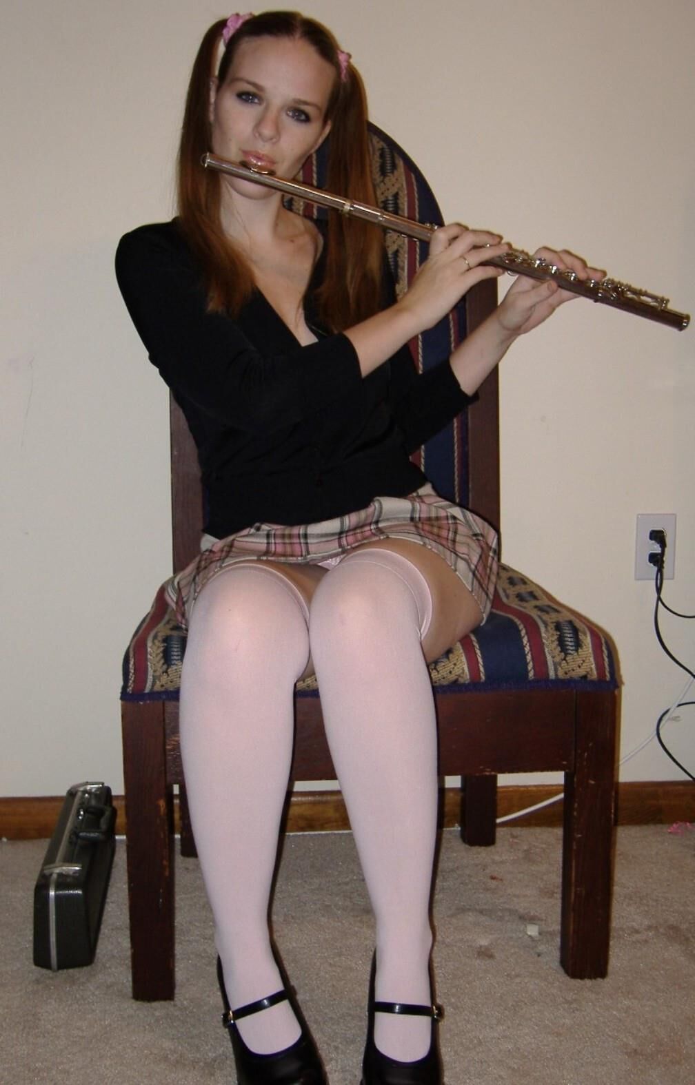 Innocent schoolgirl does naughty things with her flute