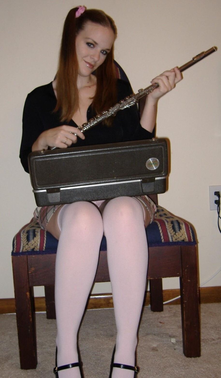 Innocent schoolgirl does naughty things with her flute